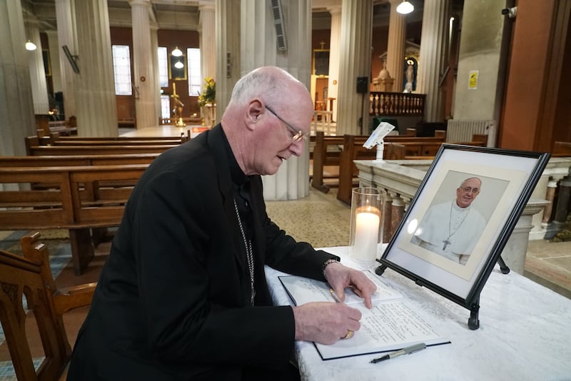 Archbishop of Dublin Dermot Farrell signs the book of condolences in Dublin’s Pro Cathedral for Pope Francis. Picture: Enda O’Dowd