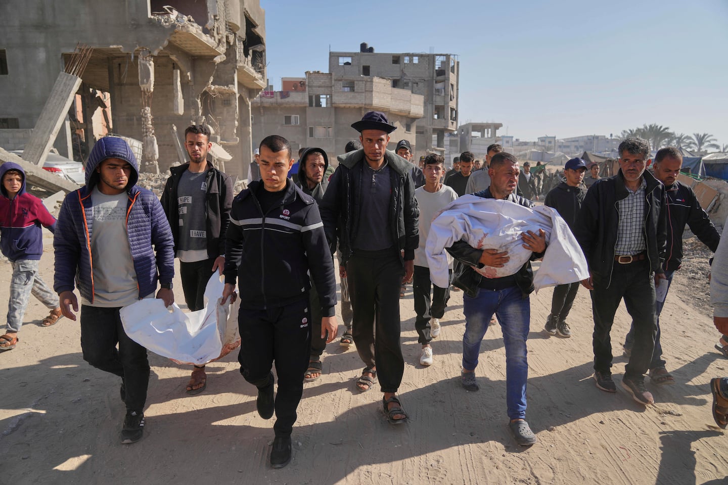 Palestinians carry the bodies of their relatives killed in an Israeli army airstrike, during their funeral in Khan Younis, southern Gaza Strip.