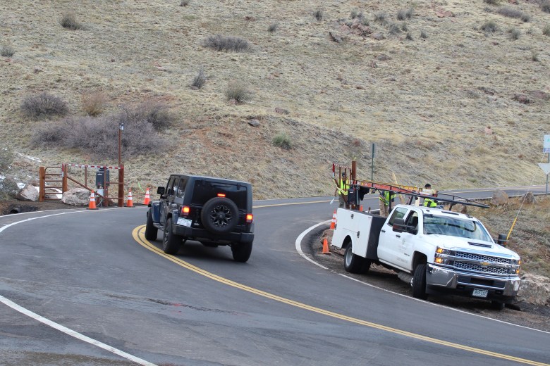 On Nov. 12, a car drives past Lookout Mountain Road's new lower gate site, which is near the lower Chimney Gulch Trail crossing