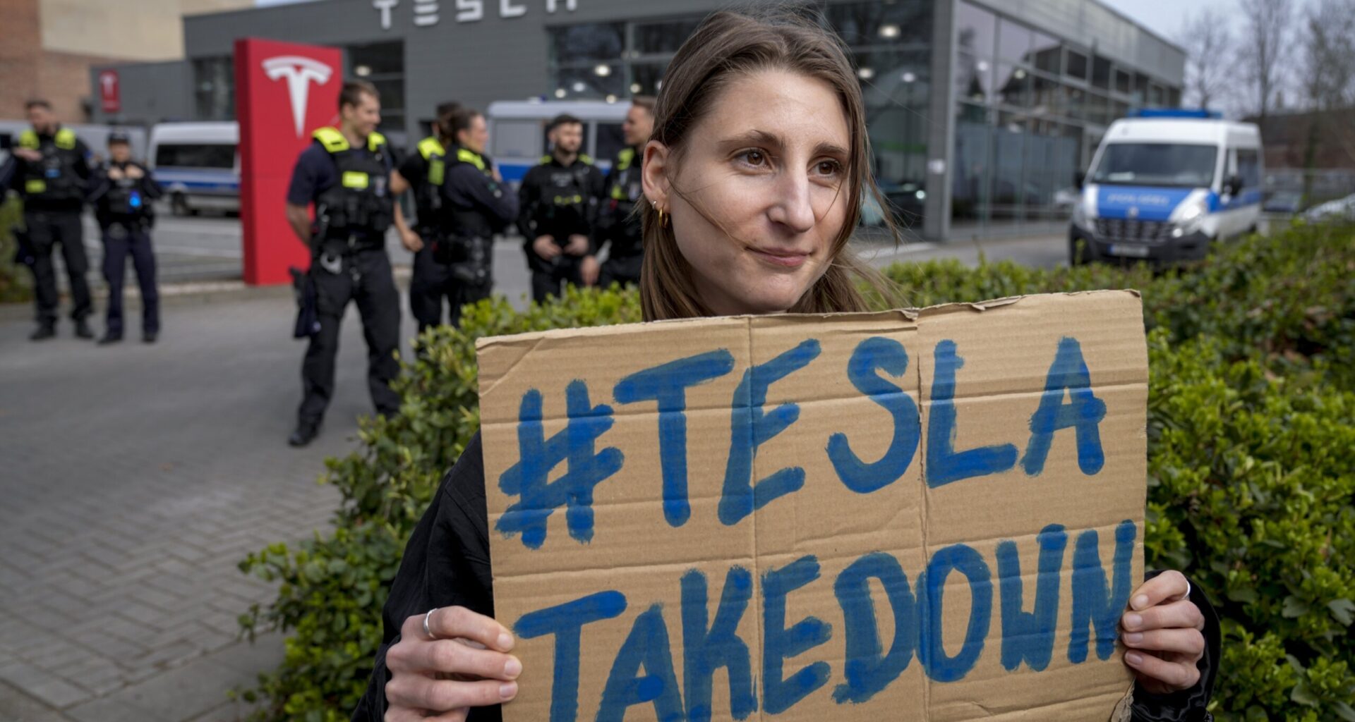 Protests continue at Tesla showrooms amid talk Elon Musk could soon leave DOGE