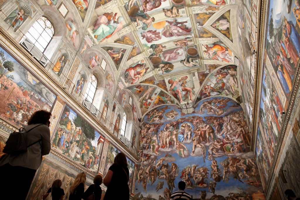 VATICAN CITY, VATICAN - JUNE 01: (EDITORIAL NEWS  USE ONLY – STRICTLY NO COMMERCIAL OR MERCHANDISING USAGE) Vistors view the Sistine Chapel frescoes at the Vatican Museums on June 01, 2020 in Vatican City, Vatican. The Vatican Museums reopened today to the public, while following the safety guidelines prescribed by Italian and Vatican health officials. They will be accessible only by reservation. (Photo by Franco Origlia/Getty Images)
