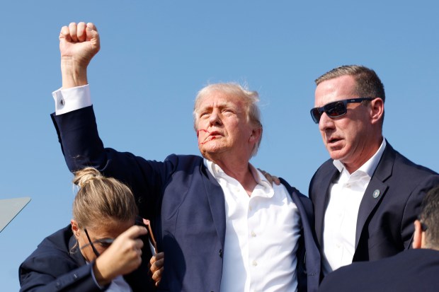 Former President Donald Trump is rushed offstage during a rally on July 13, 2024 in Butler, Pennsylvania.