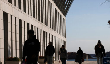 Students walk through the campus of UMass Boston. Credit: Suzanne Kreiter/The Boston Globe via Getty Images