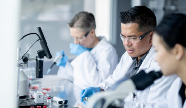 lab researchers and microscopes