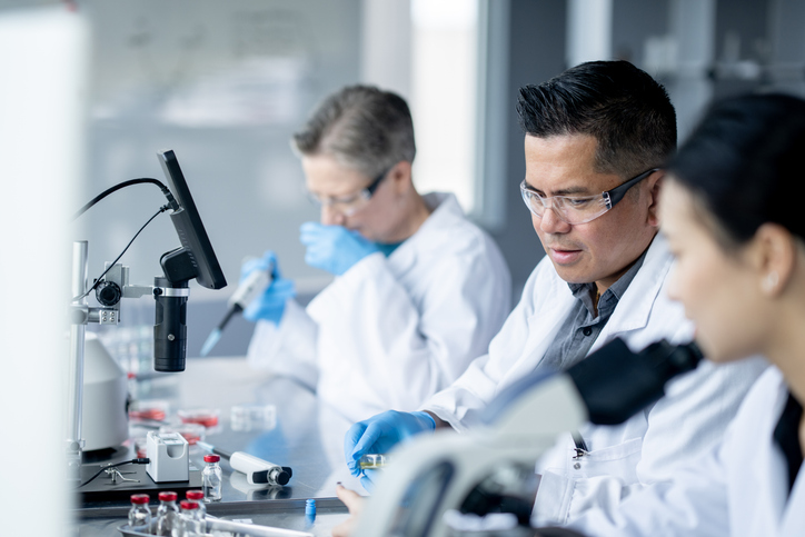 lab researchers and microscopes