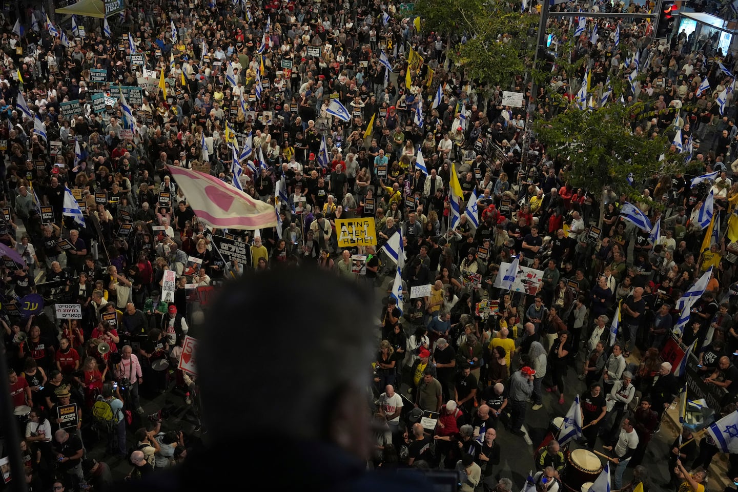 People take part in a protest demanding the immediate release of hostages held by Hamas in the Gaza Strip, in Tel Aviv.