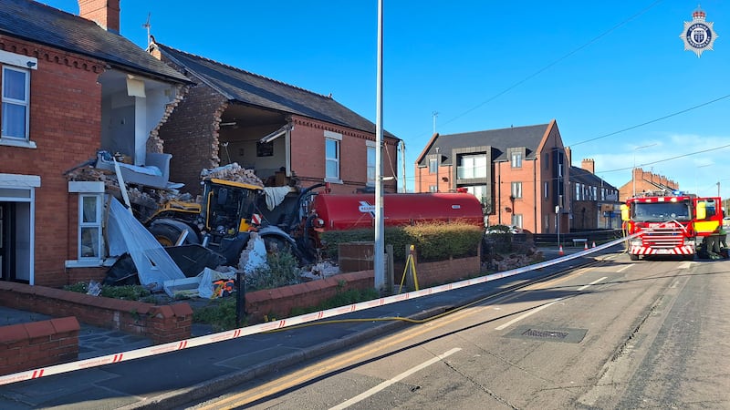 Tractor crashes into front of two houses