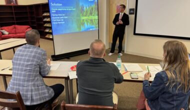 Madison High School Junior Casey Sunderland pitches a landscape business to judges.