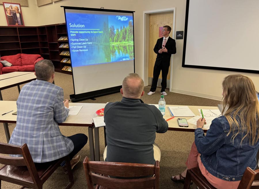 Madison High School Junior Casey Sunderland pitches a landscape business to judges.