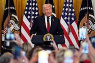 President Donald Trump speaks at a reception celebrating Women's History Month in the East...