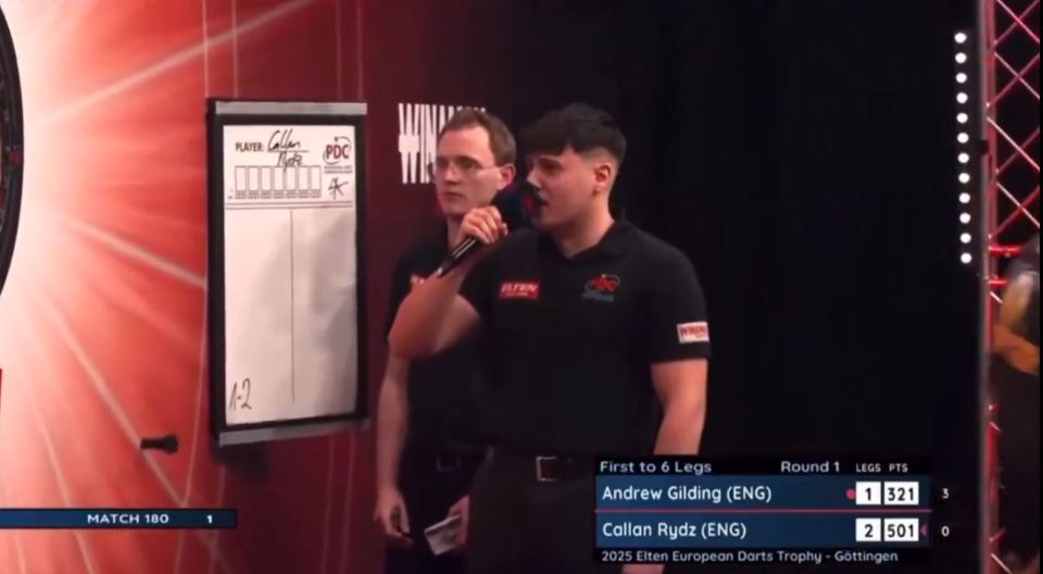 Darts players Andrew Gilding and Callan Rydz during a match.