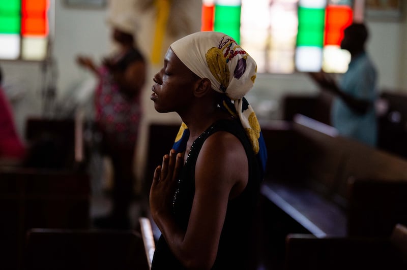 A woman prays at the Cathedral Sainte Thérèse in Port-au-Prince in Haiti on Monday. Photo: Getty Images