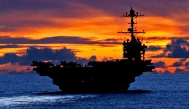 The aircraft carrier USS George Washington sails through calm seas near Guam at sunset while under way in the Pacific Ocean, Sept. 8, 2012. The George Washington is the centerpiece of Carrier Strike Group 5, the US Navy’s only continuously forward deployed carrier strike group, based out of Yokosuka, Japan. Carrier Strike Group 5 is currently on a routine Western Pacific patrol. Image Credit: Creative Commons.