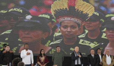 A rebel group begins handing weapons over to the Colombian government as peace talks advance