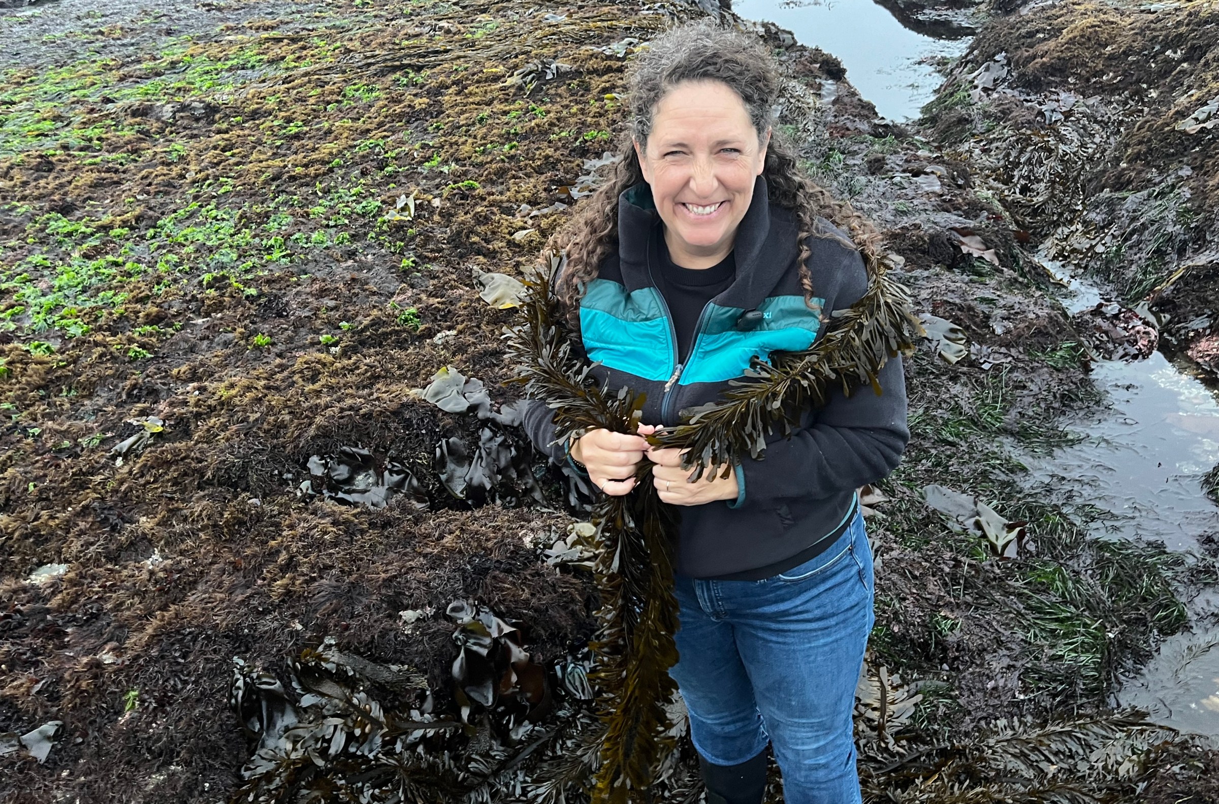Rebecca Johnson wears a feather boa kelp like a feather boa. 