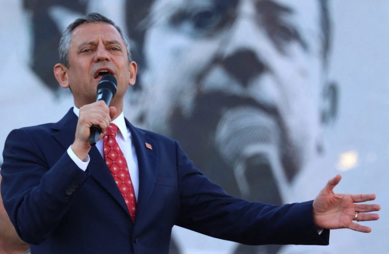 Ozgur Ozel , leader of Turkey's main opposition Republican People's Party (CHP), delivers a speech during a rally after his reelection as leader of the party during an extraordinary congress of the party in Ankara on April 6, 2025. The leader of Turkey's main opposition party on Sunday called for expected elections to be held "at the latest in November" following the country's most widespread unrest in a decade. (Photo by Adem ALTAN / AFP) (Photo by ADEM ALTAN/AFP via Getty Images)