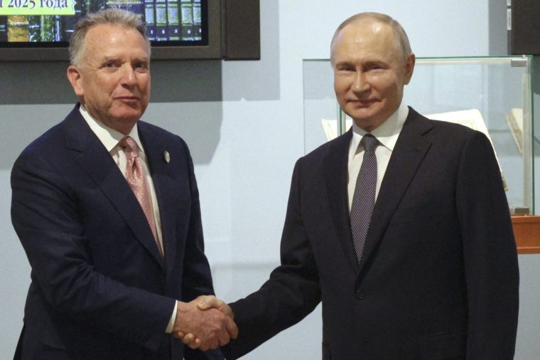 Russian President Vladimir Putin, right, and U.S. President Donald Trump's special envoy Steve Witkoff shake hands prior to their talks in St. Petersburg, Russia, Friday, April 11, 2025. (Gavriil Grigorov, Sputnik, Kremlin Pool Photo via AP)
