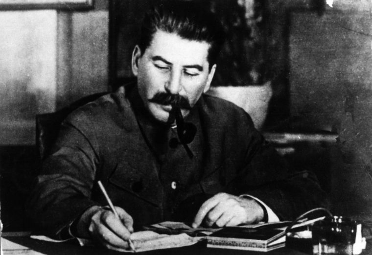 General Secretary of the Communist Party of USSR Stalin at his desk smoking a pipe. Moscow, 1945 (Photo by Mondadori via Getty Images)