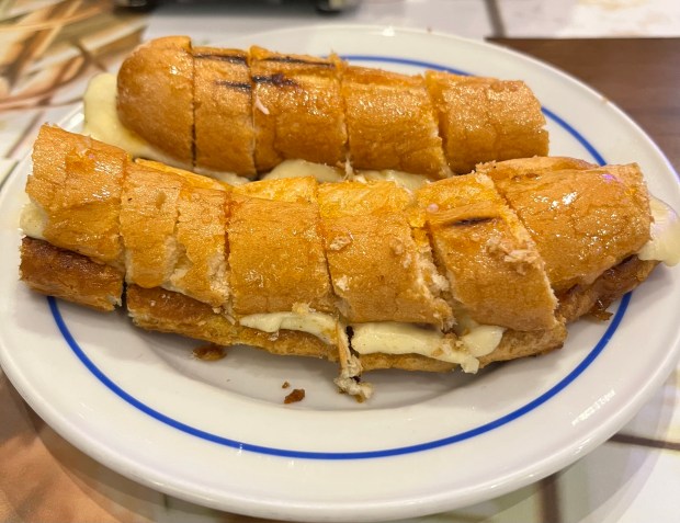 a long hot dog sliced horizontally into little pieces