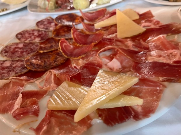 A charcuterie platter with meat and cheese