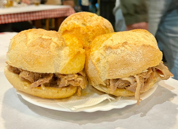 three little sandwiches on a plate