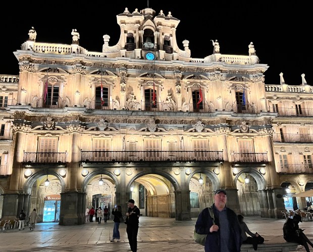 A beautiful ornate building lit up against the night sky