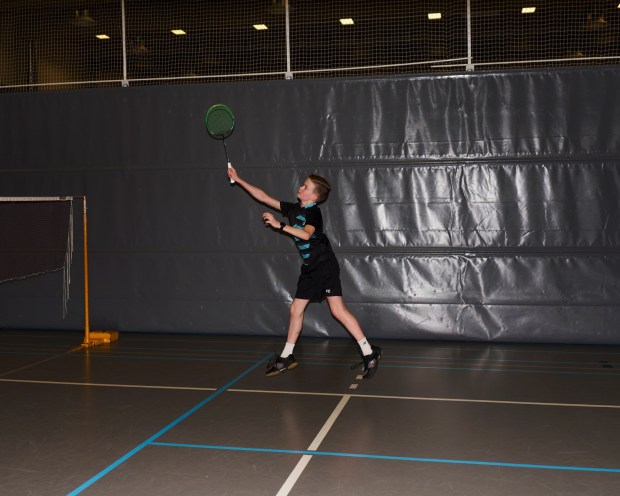 Niklas Hukari plays badminton with his sister in Ylieviska, Finland on Feb. 22, 2023. Badminton has taught Hukari that perseverance can bring satisfaction. (Jake Michaels/The New York Times)
