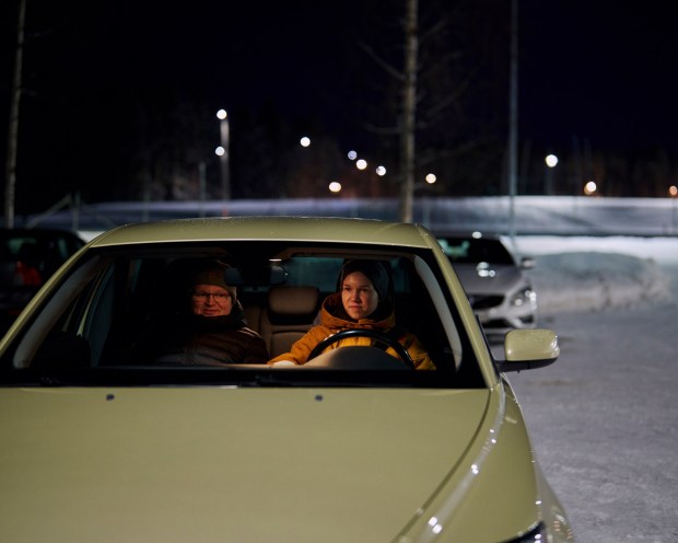 Lasse Hukari and his daughter, Henna Hukari, who just received her learner's permit for driving, in Ylieviska, Finland on Feb. 22, 2023. Finns derive satisfaction from leading sustainable lives and perceive financial success as being able to identify and meet basic needs, Arto Salonen, a professor at the University of Eastern Finland who has researched well-being in Finnish society, explained. (Jake Michaels/The New York Times)