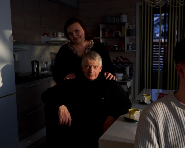 Tuomo Puutio, a retired farmer, and his daughter, Marjukka, an orchestra manager, in Lohtaja, Finland on Feb. 23, 2023. ​​In Finland, "you get the chance to be a cello player, even if you are a farmer's daughter," Marjukka said. (Jake Michaels/The New York Times)
