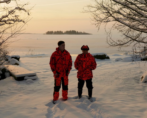 Tuomo Puutio, a retired farmer, and his grandson, Johannes Puutio, in Lohtaja, Finland on Feb. 22, 2023. Thanks to Finland's school system, which includes music education for all children, his daughter, Marjukka, was able to pursue her dream of a music career beyond their village. (Jake Michaels/The New York Times)