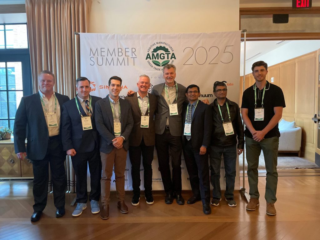 The Continuum Powders team with Rich Voorberg and Ramesh Subramanian of Siemens Energy at the AMGTA Annual Member Summit 2025. Photo via Continuum Powders.
