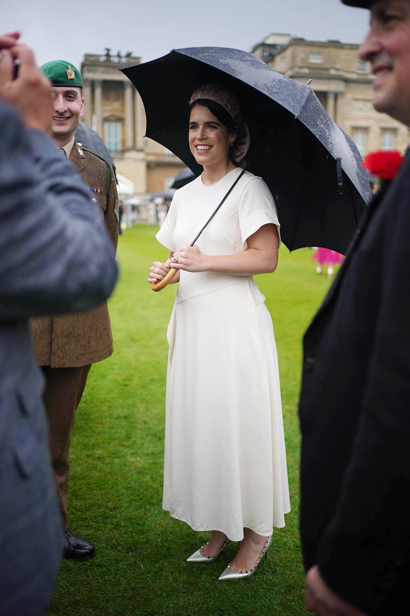 Image may contain Person Clothing Footwear Shoe Adult Hat Face Head Photography Portrait Grass Plant and Dress