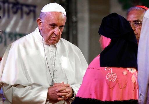 Pope Francis meets Rohingya Muslims refugees from Myanmar during an interfaith and ecumenical meeting for peace in the garden of the archbishop's residence, in Dhaka, Bangladesh