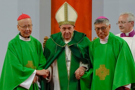 Pope Francis is joined by Cardinal John Tong Hon, left, and Cardinal-elect Stephen Chow, both from Hong Kong, after presiding over a mass at the Steppe Arena in the Mongolian capital Ulaanbaatar on September 3, 2023