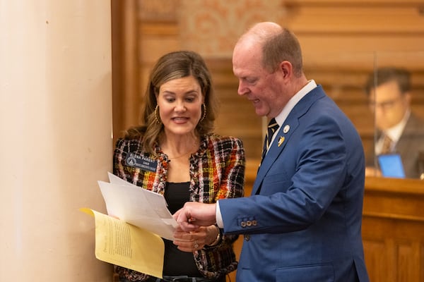 State Sen. Elena Parent, D-Atlanta, and Rep. Holt Persinger, R-Winder, speak about an amendment to a school safety bill at the Capitol in Atlanta on Monday.
