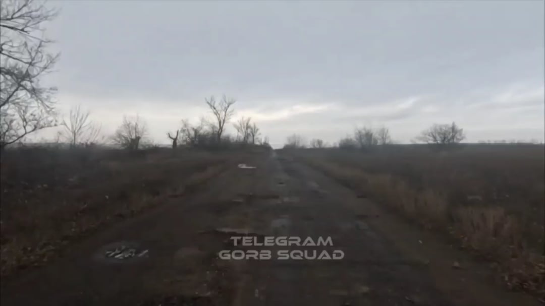 Russian soldier riding a dirt bike gets injured by a FPV hitting the ground next to him.