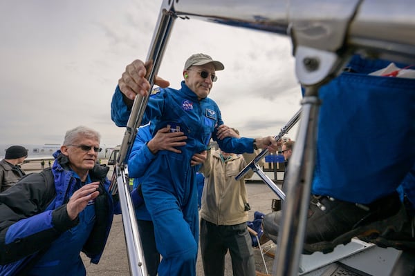 This image provided by NASA shows astronaut Don Pettit boarding a NASA airplane to take him from Karaganda, Kazakhstan to Houston after he, Roscosmos cosmonauts Alexey Ovchinin, and Ivan Vagner landed in their Soyuz MS-26 spacecraft near the town of Zhezkazgan, Kazakhstan on Sunday, April 20, 2025. (NASA/Bill Ingalls)