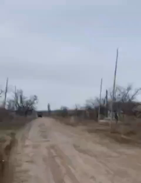 A Russian soldier films the moment a Ukrainian FPV quad hits a Ural truck while his comrades try to shoot down the UAV.