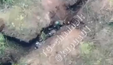 Ukrainian Soldier finishes a defeated Russian after a hand to hand engagement. (Drone POV)