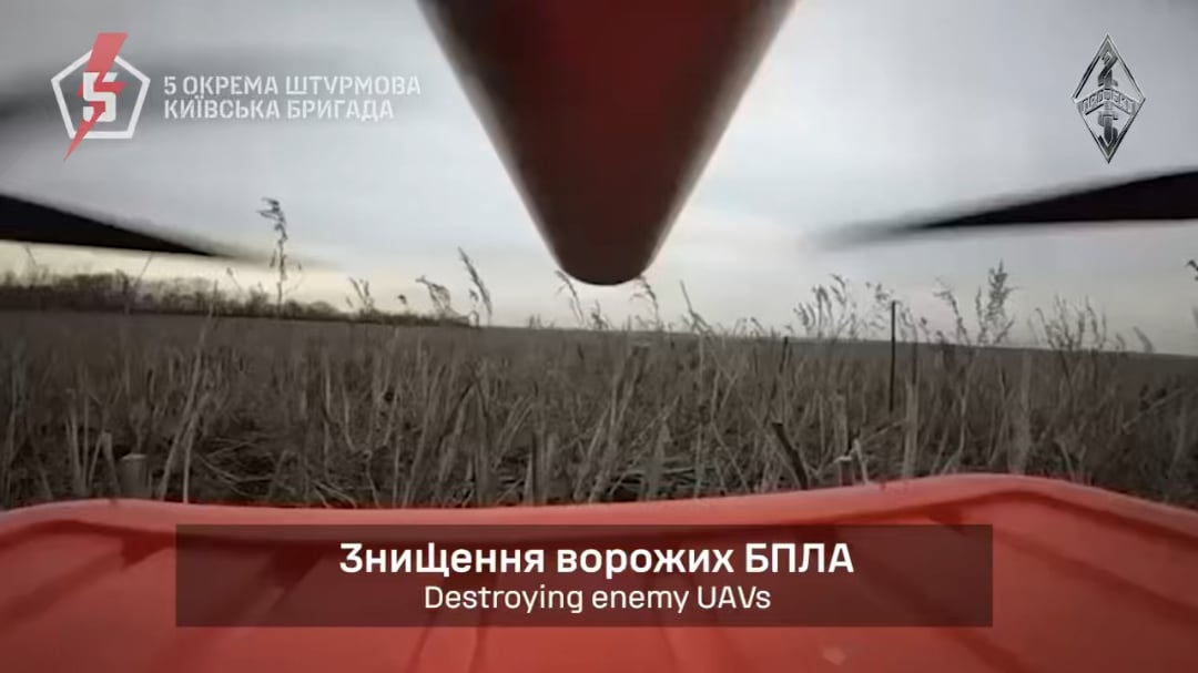 A drone with a shotgun of the 5th assault Brigade of the Armed Forces of Ukraine shoots down a Russian quadcopter. April 2025.