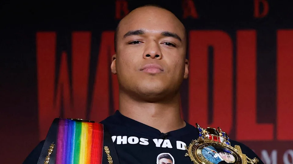 Fabio Wardley holding two boxing belts