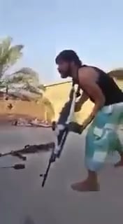 Iraqi volunteer gets his head snapped by isis sniper the moment he tries to fire his pkm, exact date/location are unknown.