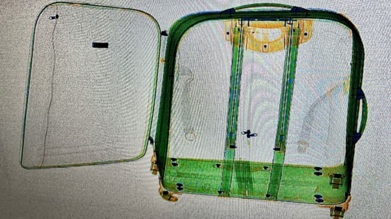 An x-ray shows 2kgs of cocaine concealed in the lining of a passenger’s suitcases.