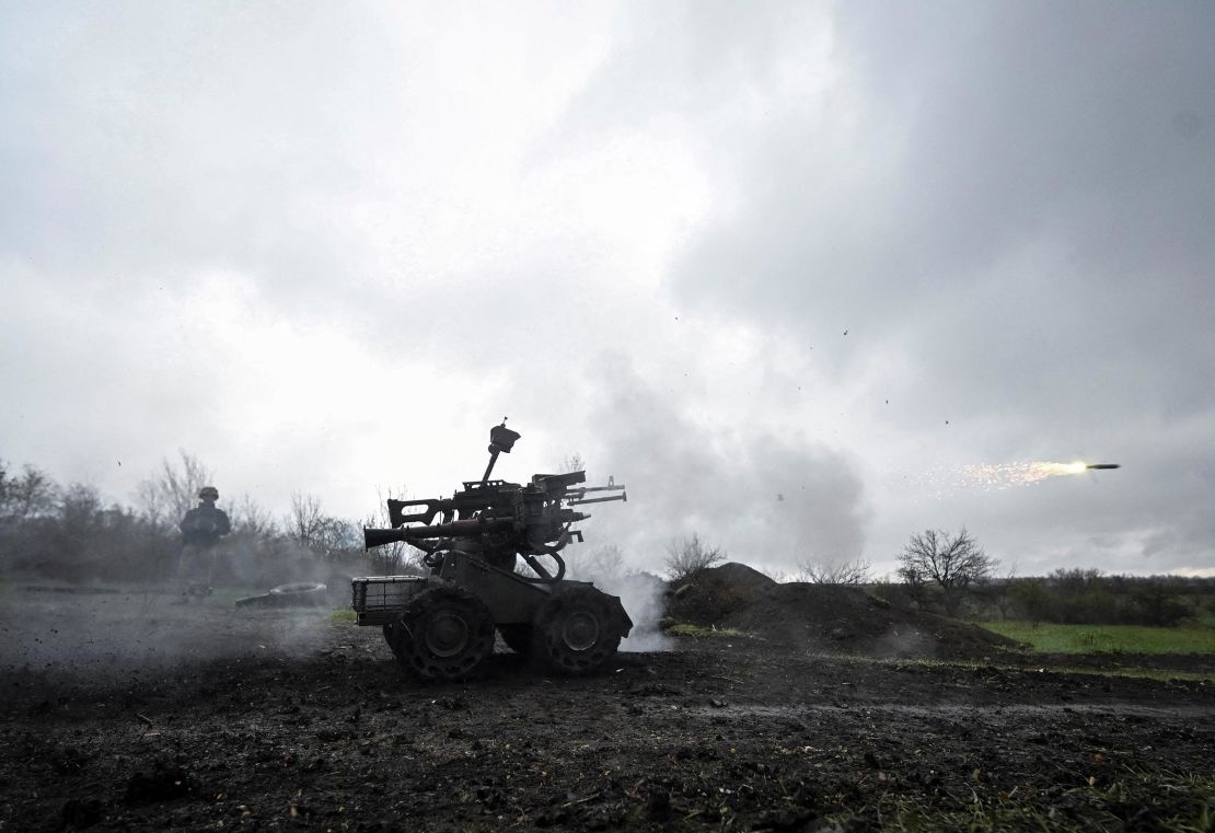 A member of the 65th Separate Mechanized Brigade of the Armed Forces of Ukraine fires a RPG-7 grenade launcher which is mounted on an unmanned ground vehicle during a training, amid Russia's attack on Ukraine, in Zaporizhzhia region of Ukraine on April 9. 