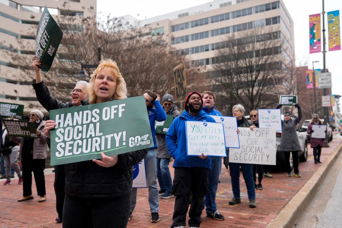 Demonstrators gather outside of the Edward A. Garmatz United States District Courthouse in Baltimore on Friday, March 14.