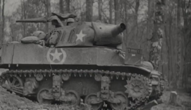 Howitzer Motor Carriage M8 battery in action firing from a wooded area circa late 1944