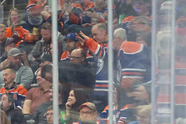 Canadian Prime Minister Mark Carney enjoys the game between the Edmonton Oilers and the Winnipeg Jets during the second period at Rogers Place on March 20, 2025 in Edmonton, Canada