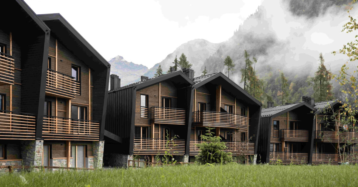 G22 projects tucks mountain village lodges in italy's alpine peaks