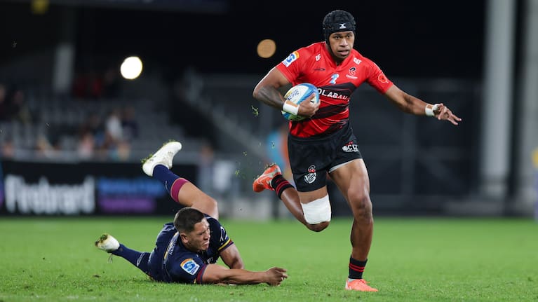 Crusaders wing Chay Fihaki breaks away to score against the Highlanders in Dunedin.
