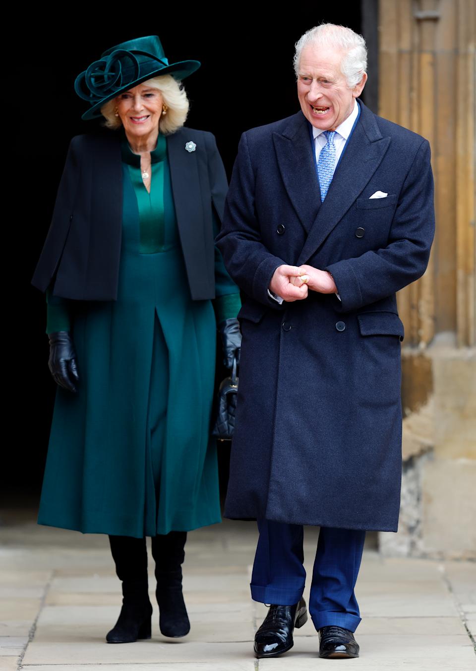 Queen camilla wearing a green dress walking next to King Charles on Easter 2024